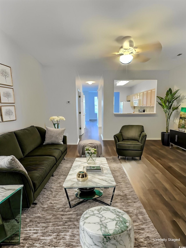 living room featuring hardwood / wood-style flooring and ceiling fan