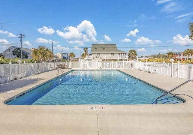 view of swimming pool featuring a patio