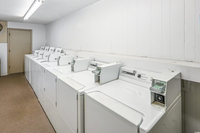 clothes washing area featuring washing machine and clothes dryer