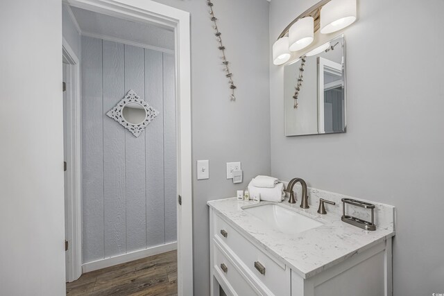 bathroom with vanity and hardwood / wood-style flooring