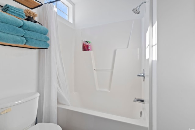 bathroom featuring toilet and shower / bath combo with shower curtain