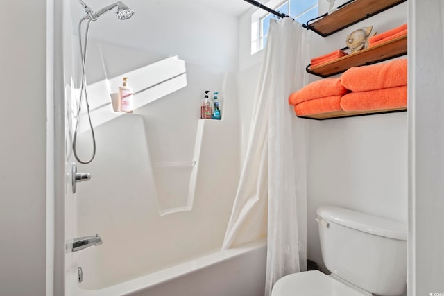 bathroom with shower / bath combo and toilet