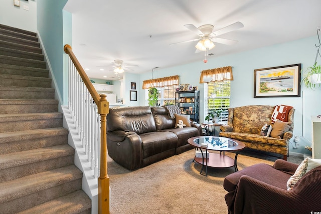 carpeted living room featuring ceiling fan