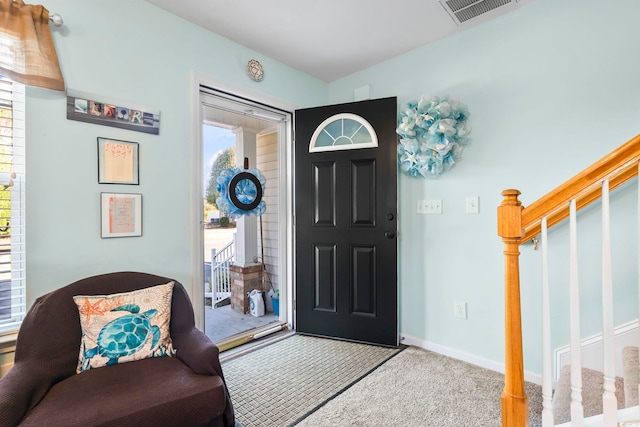 entrance foyer featuring carpet