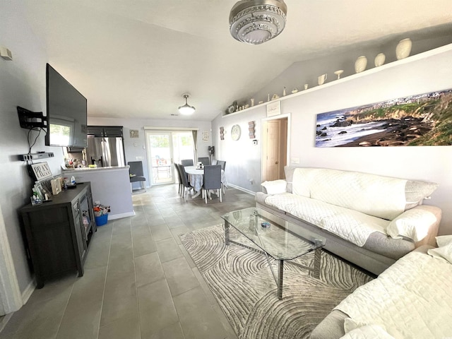 living room featuring vaulted ceiling