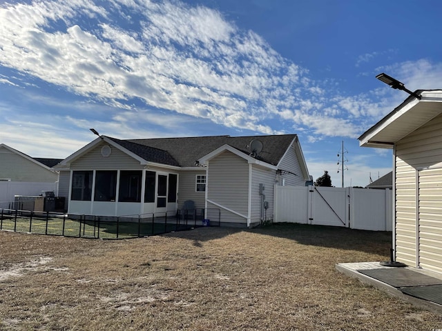 rear view of house with a sunroom