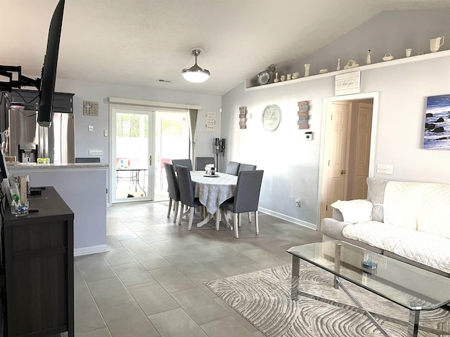 tiled living room with vaulted ceiling