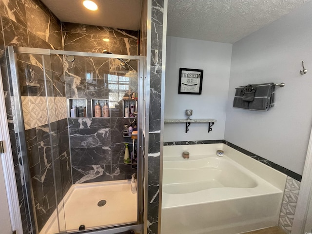 bathroom with a textured ceiling and plus walk in shower