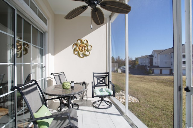 sunroom / solarium with ceiling fan