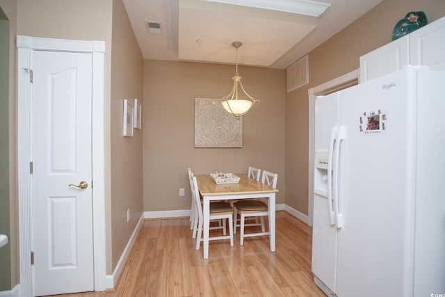 dining area with light wood-type flooring