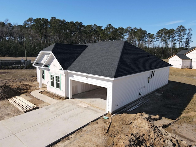 view of side of home with a garage