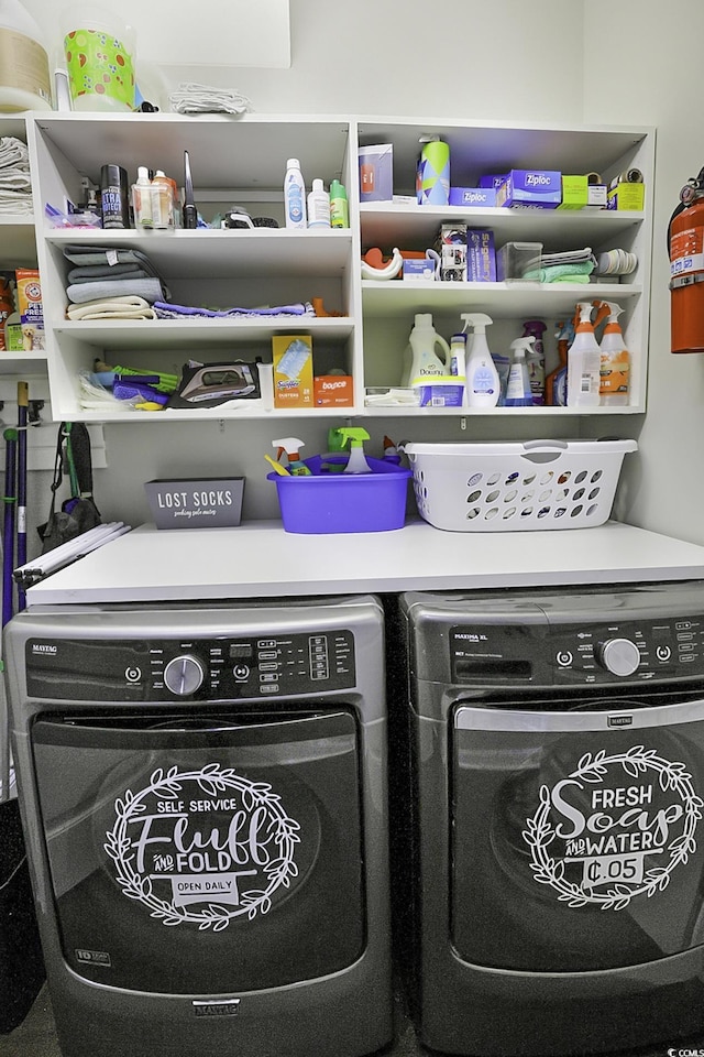 washroom featuring washing machine and dryer