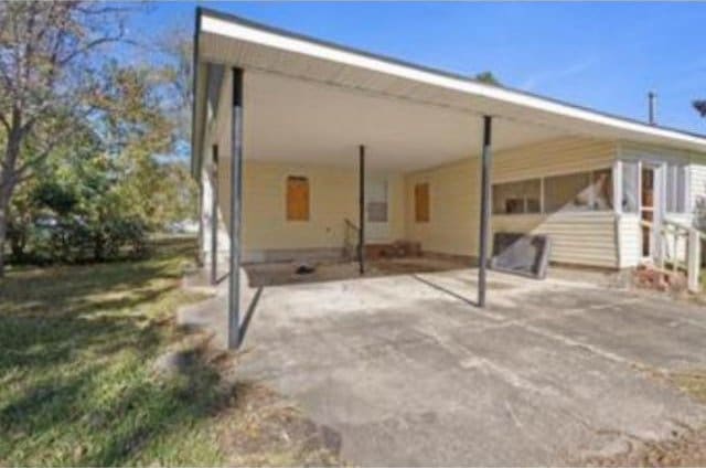 exterior space with a carport