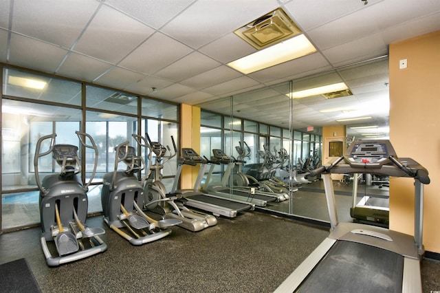 gym featuring a paneled ceiling