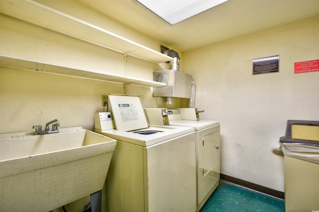 washroom featuring washer and dryer and sink