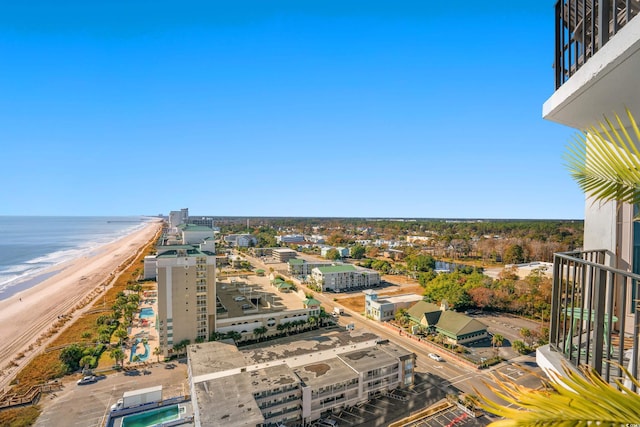 drone / aerial view with a beach view and a water view