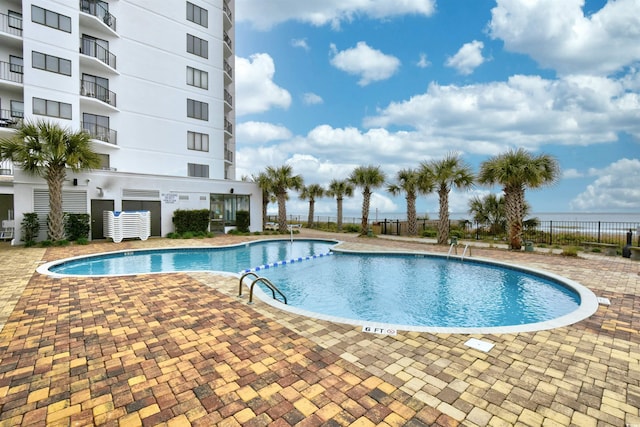 view of pool featuring a patio