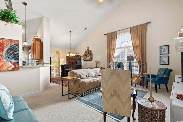 carpeted living room featuring high vaulted ceiling and a chandelier