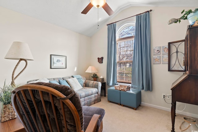 carpeted living room featuring ceiling fan and vaulted ceiling