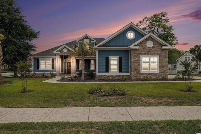 1201 Surf Pointe Dr, North Myrtle Beach, SC 29582 - view of front of home featuring stone siding, board and batten siding, and a lawn