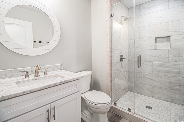 1201 Surf Pointe Dr, North Myrtle Beach, SC 29582 - bathroom featuring toilet, a shower stall, and vanity