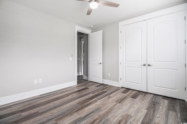 1201 Surf Pointe Dr, North Myrtle Beach, SC 29582 - unfurnished bedroom featuring wood finished floors, a closet, baseboards, and ceiling fan