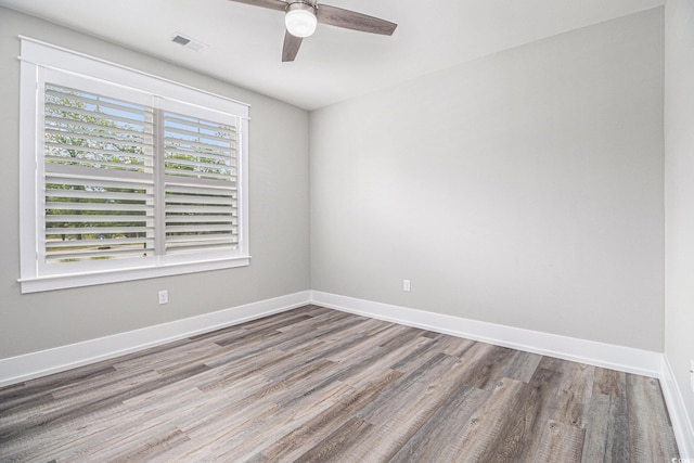 1201 Surf Pointe Dr, North Myrtle Beach, SC 29582 - spare room with wood finished floors, ceiling fan, and baseboards