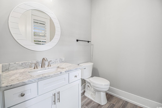 1201 Surf Pointe Dr, North Myrtle Beach, SC 29582 - bathroom with toilet, vanity, wood finished floors, and baseboards