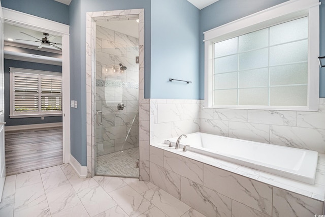 1201 Surf Pointe Dr, North Myrtle Beach, SC 29582 - bathroom with marble look tiles, a bath, a marble finish shower, ceiling fan, and baseboards