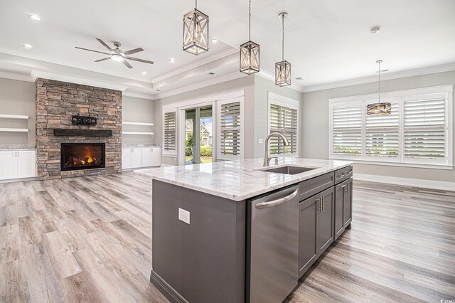 1201 Surf Pointe Dr, North Myrtle Beach, SC 29582 - kitchen featuring stainless steel dishwasher, a sink, light wood-type flooring, open floor plan, and crown molding