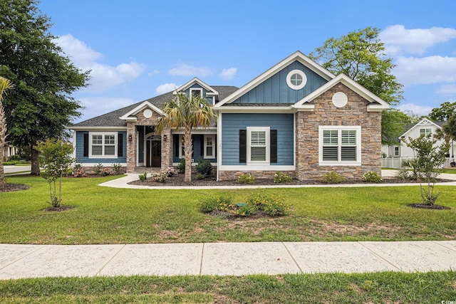 1201 Surf Pointe Dr, North Myrtle Beach, SC 29582 - craftsman-style home with stone siding, board and batten siding, and a front yard