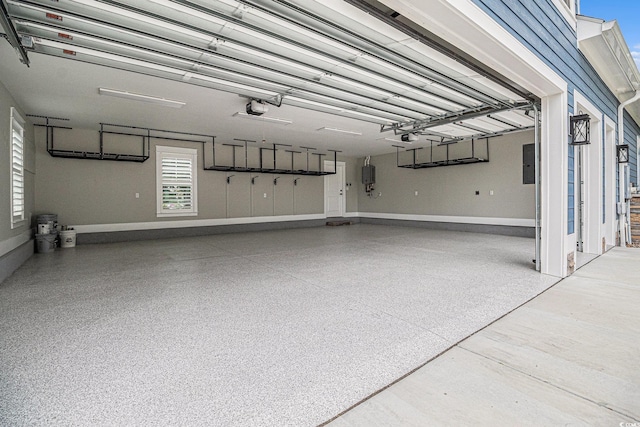 1201 Surf Pointe Dr, North Myrtle Beach, SC 29582 - garage with a garage door opener and electric panel