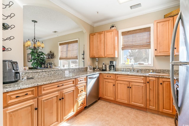 kitchen featuring a sink, stainless steel appliances, arched walkways, crown molding, and hanging light fixtures