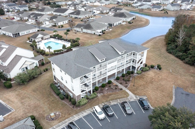 aerial view with a residential view and a water view