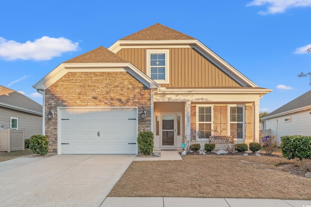 craftsman-style house featuring covered porch and a garage