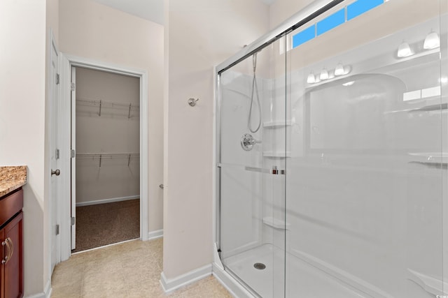 bathroom with vanity and walk in shower