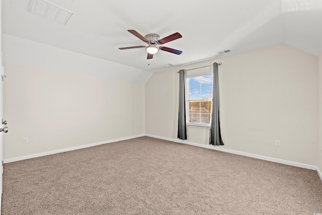 additional living space with carpet flooring, ceiling fan, and lofted ceiling