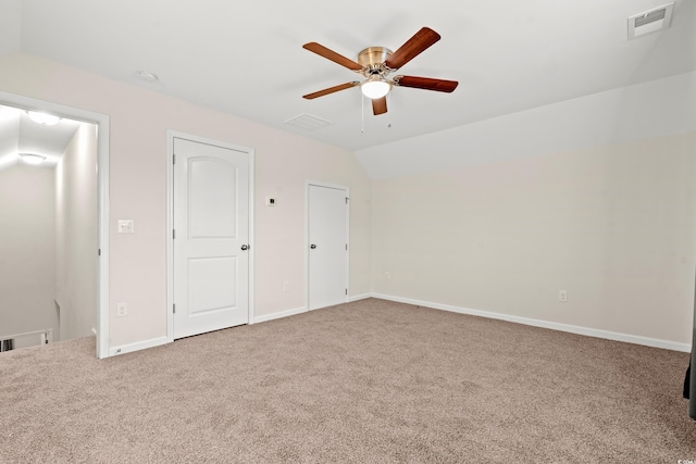 unfurnished bedroom with carpet flooring, ceiling fan, and lofted ceiling