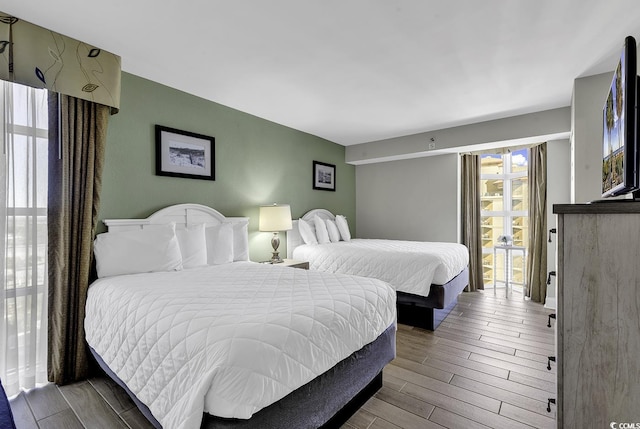 bedroom featuring wood tiled floor