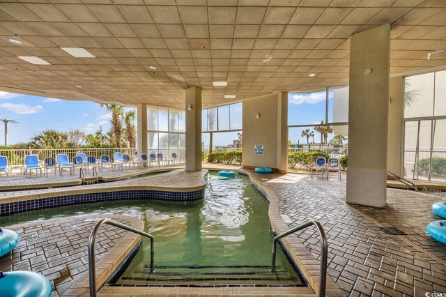 view of pool featuring fence and a patio