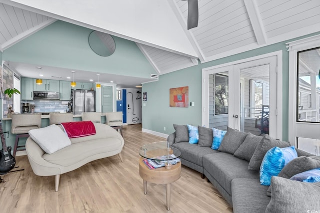 living room featuring beamed ceiling, french doors, high vaulted ceiling, and light hardwood / wood-style flooring