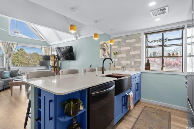 kitchen featuring dishwasher, plenty of natural light, kitchen peninsula, and hanging light fixtures