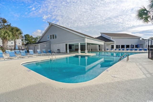 view of swimming pool featuring a patio area