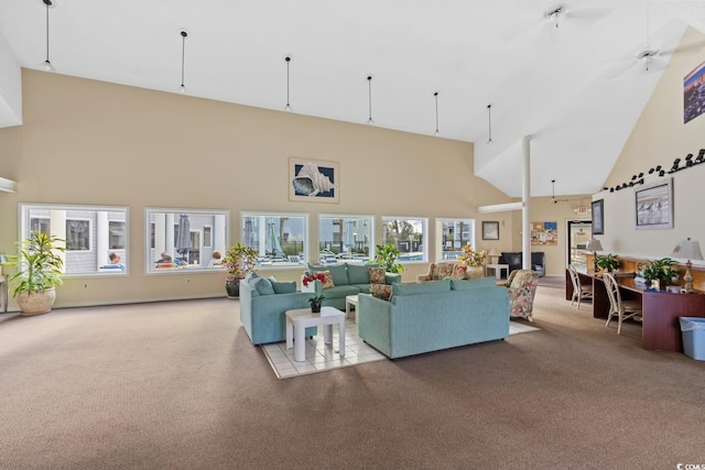 living room featuring light carpet, high vaulted ceiling, a wealth of natural light, and ceiling fan