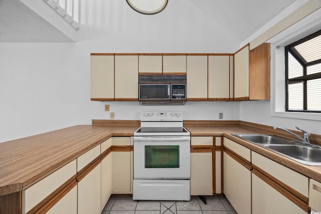 kitchen featuring sink, light tile patterned floors, a textured ceiling, and white electric stove