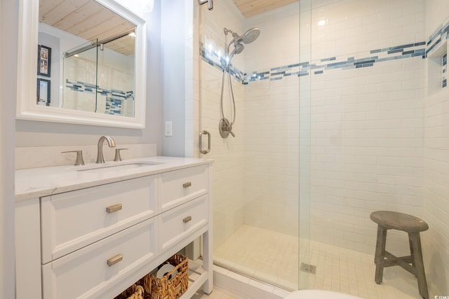 bathroom with vanity and a shower with shower door