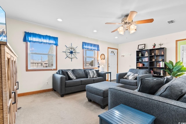 living room featuring light carpet and ceiling fan