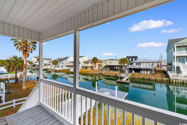 deck featuring a dock and a water view