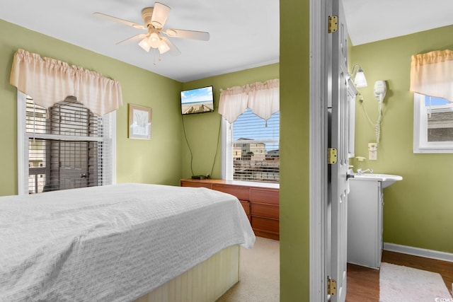 310 46th Ave N, North Myrtle Beach, SC 29582 - bedroom featuring wood finished floors and ceiling fan