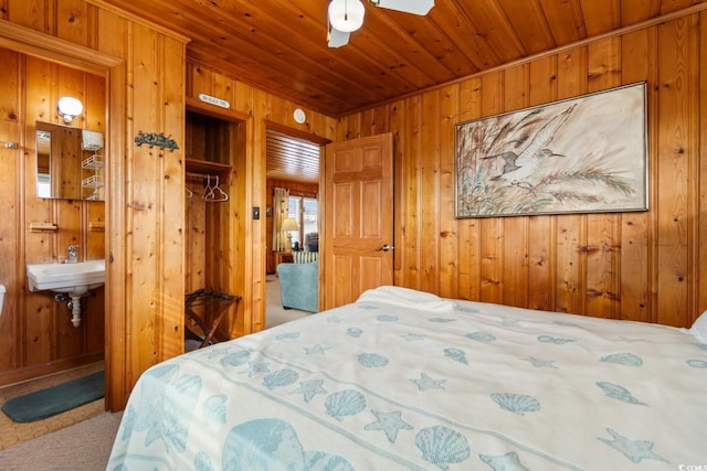 310 46th Ave N, North Myrtle Beach, SC 29582 - carpeted bedroom featuring wood walls and wood ceiling